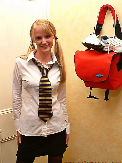 Blonde schoolgirl Sharon in pigtails gets the strip show started