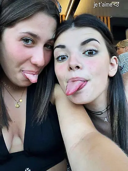 Teens tongues out