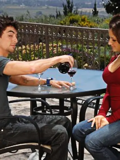 Lovable brunette has a glass of wine and rides dude's meaty tool