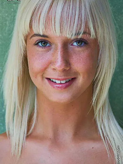 Fair-haired teenage girl Natali Blond shows pink inner area of h