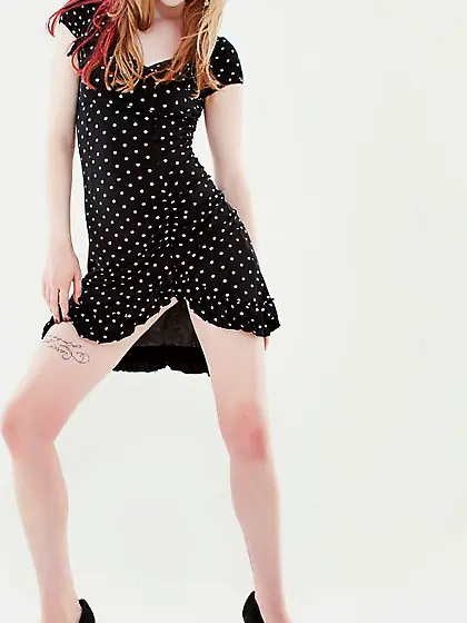 Pale skinned tattooed blonde Ela Darling strips her black dress