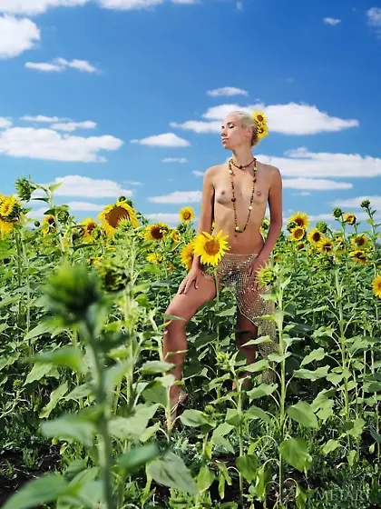 Sunflower field beauty showing her small boobs and peachy pussy