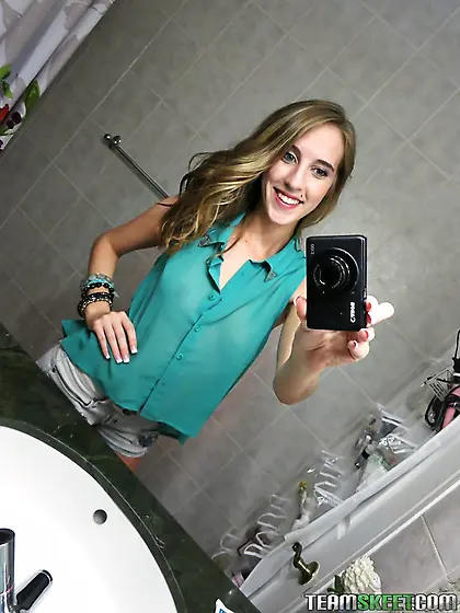 Chick takes provocative selfies in the bathroom and gets banged
