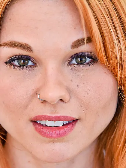 Redheaded beauty with a landing strip fucks herself with a glass