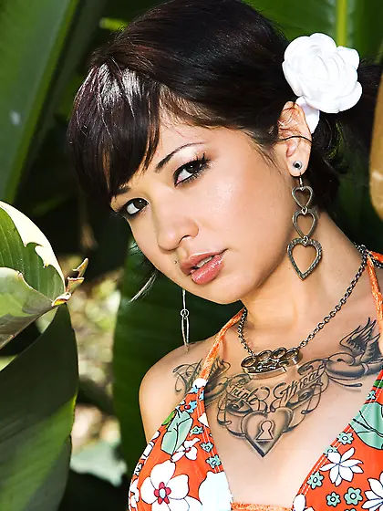 Tattooed hottie Coco Velvett with small titties stripping bikini