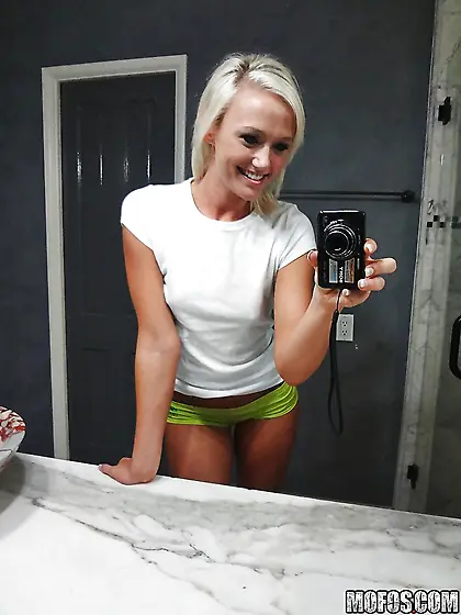 Towheaded colleen slips her panties whilst posing and taking sel