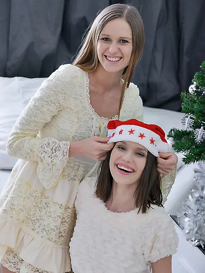 Two horny ladies are all about threesome fucking on Christmas