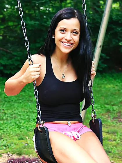 Luscious babe sits swing