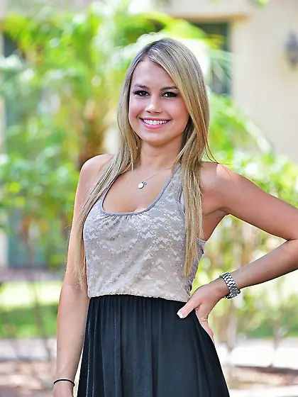 Smiling blonde model showing