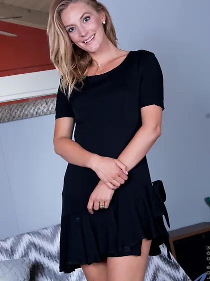 MILF takes her black dress and underwear off to pose with naked