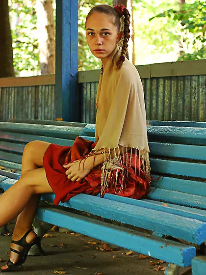 Petite Vera C shows she wears no lingerie under her outfit on a