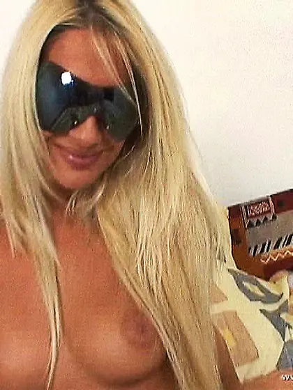 Bambi takes all of her clothes off and then pokes her cunt with