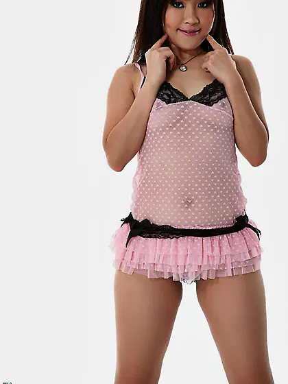 A tight fitting pink top is making Asian model Maya Maino look s