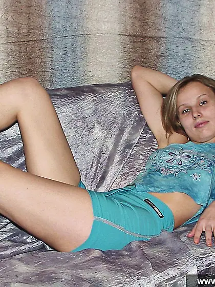 Russian teen blonde takes off dress and poses