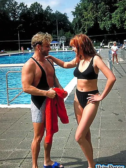 Busty redhead black swimsuit