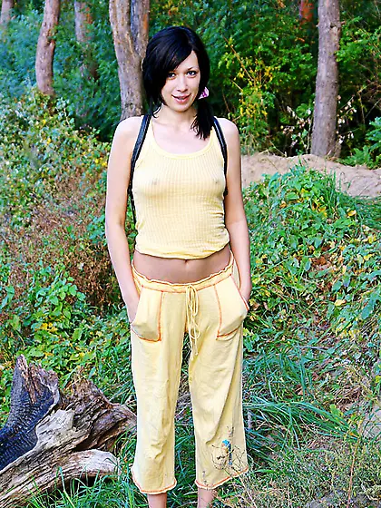 Teen babe with pig tails takes off her yellow robe and reveals h