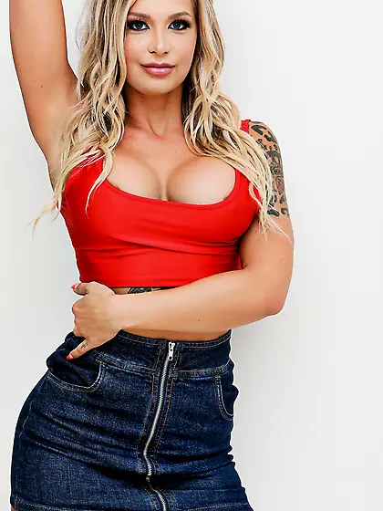 Gorgeous long-haired blondie poses