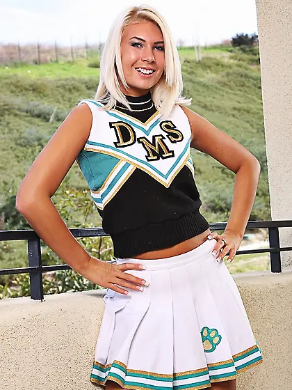 Shaved blonde Danica Blue strips off her cheerleader uniform and