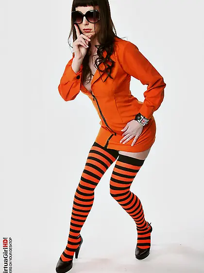 Frisky babe Jennifer Galbina ripping off her uniform and posing