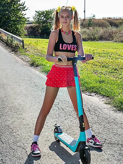 Adorable young girl Nana strips down on her scooter ride
