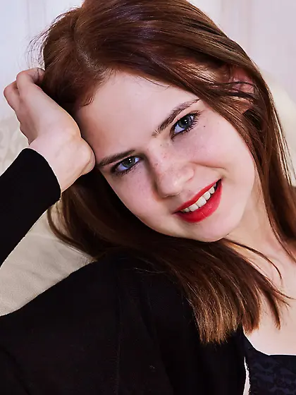 Black lingerie brunette shows her seductive soles and ample brea