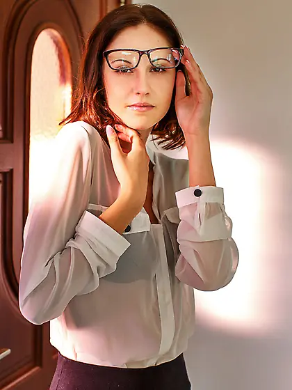 Short-haired nerdy teen girl spreads her long legs on the steps