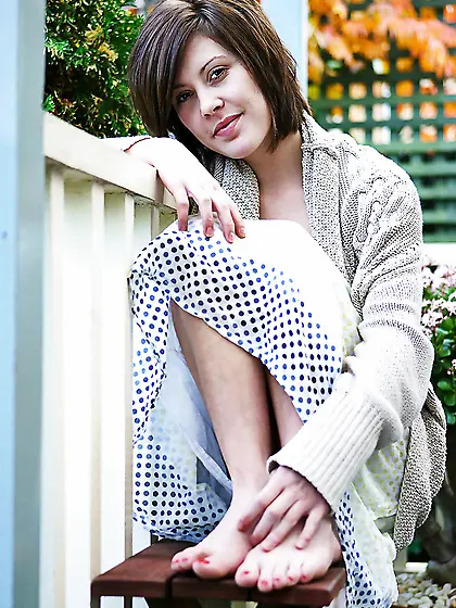 Brunette with a sexy smile showing her bush along the way