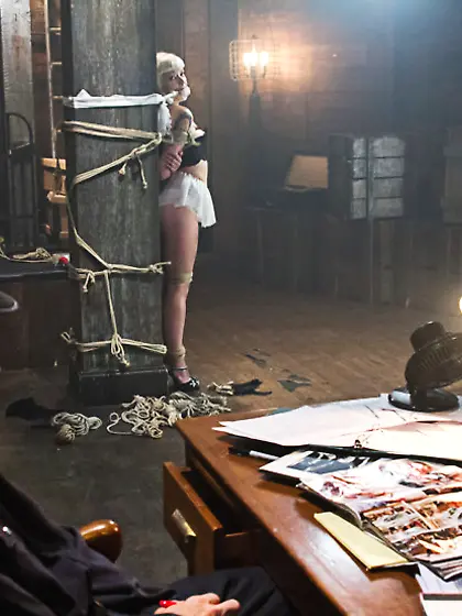 Guy ties blonde rope