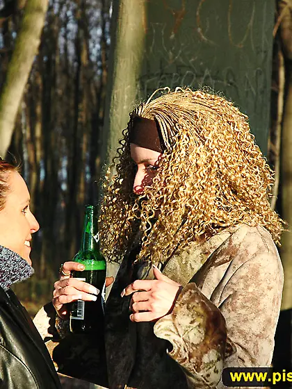 Girls pissing together outdoor