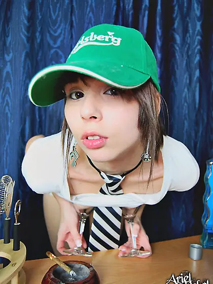 Naughty Ariel Rebel performs a striptease while mixing cocktails