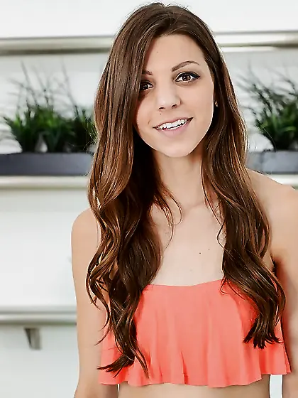 Brunette with a charming face pets her pussy and enjoys fingerin