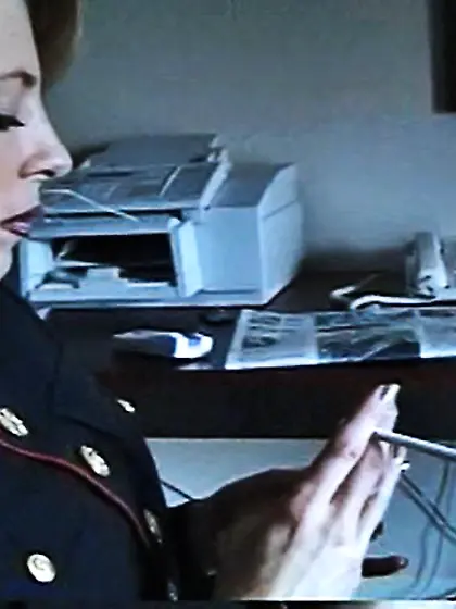 MILF in a uniform smoking a cigarette with...