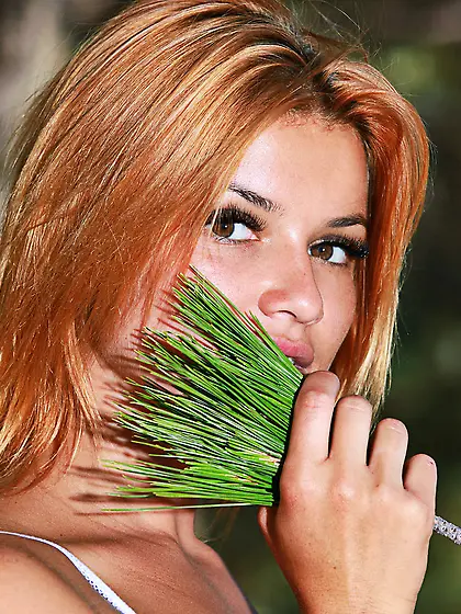 Redhead with short hair and a see-through white top gets naked o