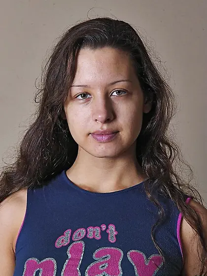 Busty brunette Marian Sokol with long legs and tight booty showi