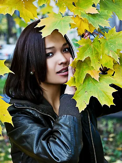 Cheerful young babe shows her pussy and natural breasts while in