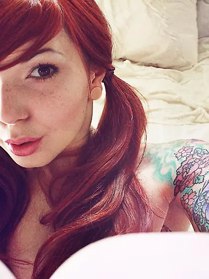 Hot redhead beauty Ivy Jean is lying with her awesome big melons