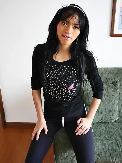 Black haired lass undressing