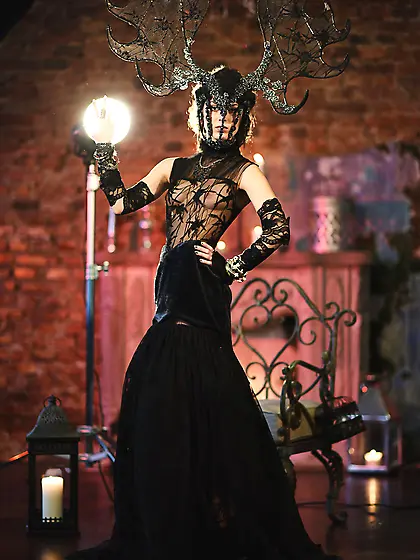 Big hairdo horny chick with horns posing half-naked in her evil