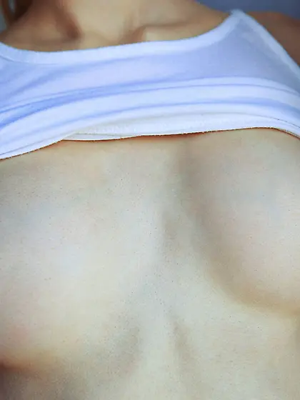 Ponytailed blonde in white shows her perfect body and smooth pus