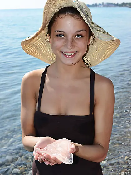 Teen sweetie with freckled face likes to walk without clothes on