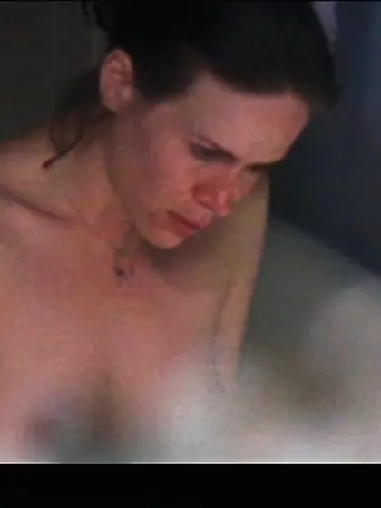 Golden MILF covers her nipples in a hot way