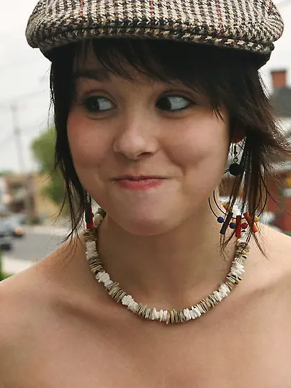 Ariel Rebel reveals her playful nature by dancing near a tree in