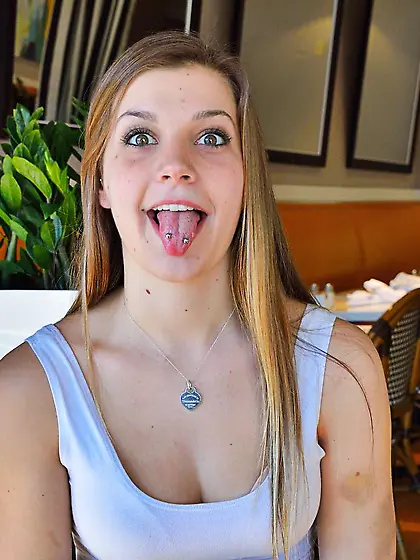 Aubrey Snow is sitting nude on couch and widely opening her puss