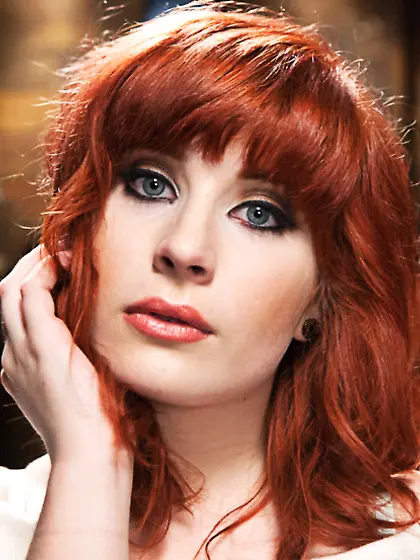 Lusty redhead loves tied