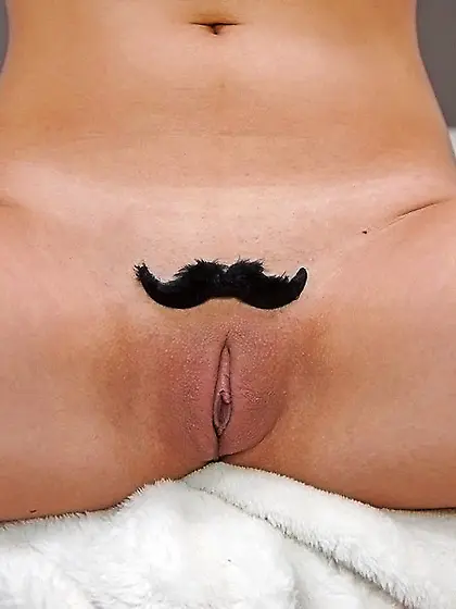 Chick with big boobs poses naked with funny mustache-looking wig