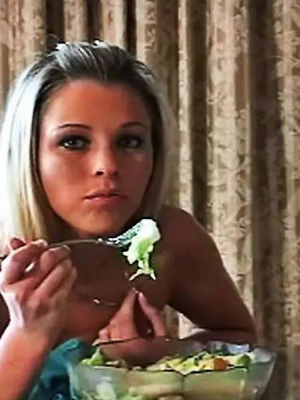 Cute blonde darling eats