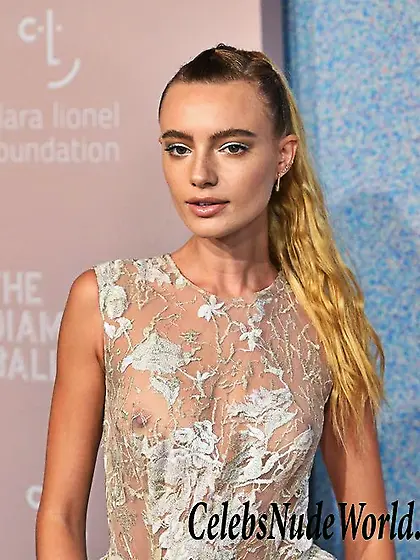 Maya Stepper Wearing A White See Thru Dress