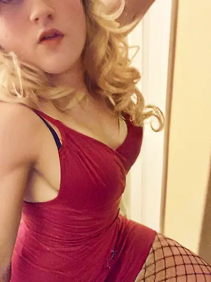 Sexy Blonde Tranny in tight Red dress and fishnets