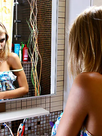 Wet blond girl Marfa Nubiles shows off her sexy ass and touches