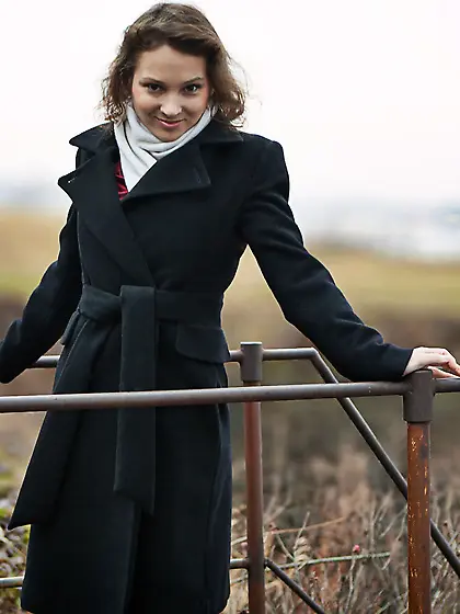 Curly-haired seductress in red lingerie plays piano before getti